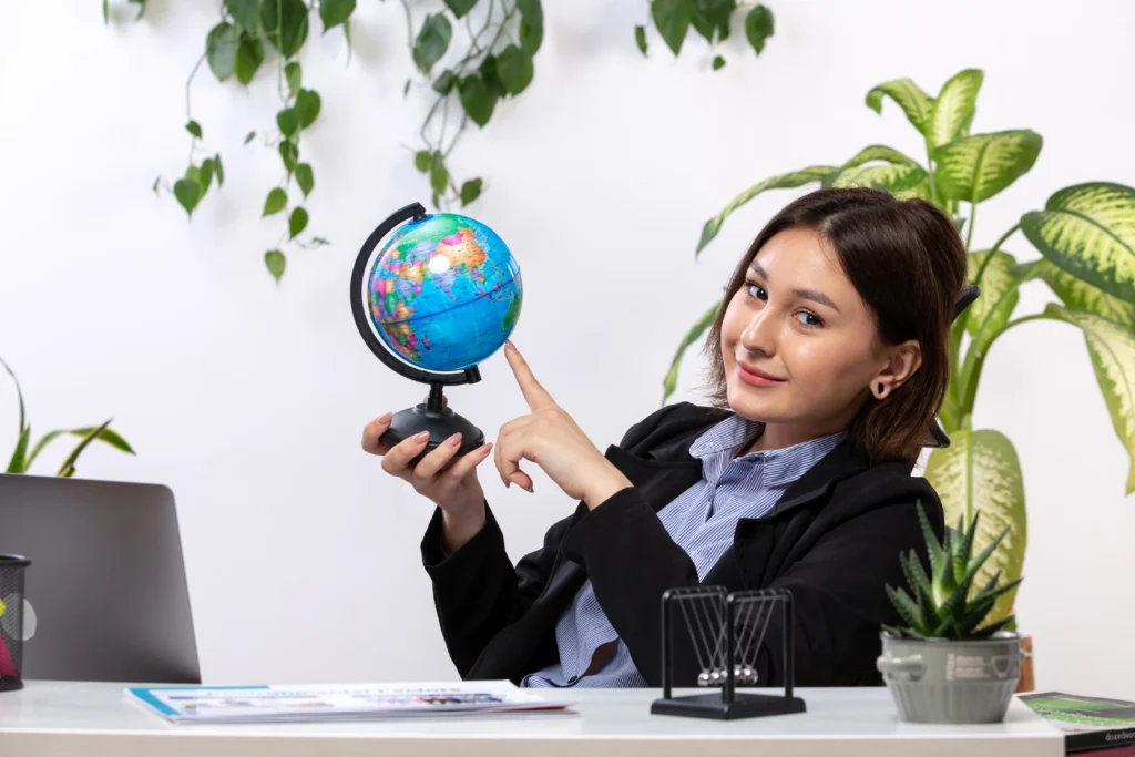 Professional visa consultant holding a globe - Shivansh Consultants